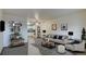 Staged living room and partial view of kitchen and stainless steel appliances at 195 S Sable Blvd # U12, Aurora, CO 80012