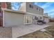 A concrete patio with a grill and French doors offering great outdoor living at 4622 S Kalispell Way, Aurora, CO 80015