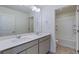 Bathroom featuring a double vanity and a tub-shower combo, providing a practical and modern design at 9882 Cathay St, Commerce City, CO 80022