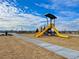Playground area with slides and walkway, ideal for outdoor activities and recreation at 9882 Cathay St, Commerce City, CO 80022
