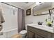 Updated bathroom boasts modern fixtures, a shower-tub combo, and a stylish vanity at 1627 S Saint Paul St, Denver, CO 80210