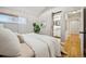 Bright bedroom featuring a barn door leading to an ensuite bathroom at 1627 S Saint Paul St, Denver, CO 80210