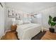 Serene bedroom with vaulted ceilings, natural light, and neutral tones at 1627 S Saint Paul St, Denver, CO 80210