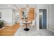 Cozy dining area with a modern light fixture and unique wood paneling feature wall at 1627 S Saint Paul St, Denver, CO 80210