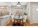 Elegant dining area featuring a modern table, stylish chairs, and a decorative chandelier at 1627 S Saint Paul St, Denver, CO 80210