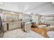 Open-concept kitchen featuring a modern island, stainless steel appliances, and marble countertops at 1627 S Saint Paul St, Denver, CO 80210