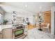 Inviting kitchen overlooking the living area, boasting stainless steel appliances and a breakfast nook at 1627 S Saint Paul St, Denver, CO 80210