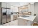 Modern kitchen featuring stainless steel appliances, white cabinetry, and a stylish backsplash at 1627 S Saint Paul St, Denver, CO 80210