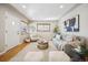 Inviting living room with a neutral color palette, wood floors, and ample natural light at 1627 S Saint Paul St, Denver, CO 80210