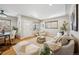 Bright and airy living room with hardwood floors and a view of the dining area at 1627 S Saint Paul St, Denver, CO 80210