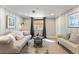 Cozy living room featuring a neutral palette, stylish furniture, and ample natural light at 1627 S Saint Paul St, Denver, CO 80210