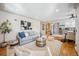 Cozy living room features a comfortable seating area, neutral walls, and wood floors at 1627 S Saint Paul St, Denver, CO 80210