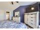 Comfortable bedroom features vaulted ceiling, contemporary furniture, an ensuite bath, and ample natural light at 13255 Holly St # B, Thornton, CO 80241