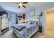 Comfortable bedroom features vaulted ceiling, contemporary furniture, a large window, and ample natural light at 13255 Holly St # B, Thornton, CO 80241