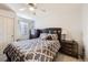 Bedroom featuring a large bed with modern furnishings and large window for natural light, for cozy and inviting space at 13255 Holly St # B, Thornton, CO 80241