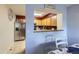 Dining area with stainless steel fridge and open kitchen view at 13255 Holly St # B, Thornton, CO 80241