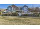 Charming townhome with blue and brown exterior, manicured lawn, and inviting front porch at 13255 Holly St # B, Thornton, CO 80241