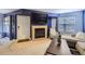 Inviting living space with a fireplace, cozy seating, and modern decor at 13255 Holly St # B, Thornton, CO 80241