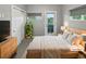 Serene bedroom featuring a large window, closet, and stylish furnishings at 1245 Utica St # 104, Denver, CO 80204