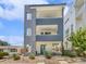 Modern three-story home with eye-catching architectural details and a welcoming entrance at 1245 Utica St # 104, Denver, CO 80204