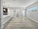 Spacious living space with an open floor plan and sleek laminate flooring at 1245 Utica St # 104, Denver, CO 80204