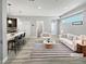 Bright living space with an open floor plan, sleek finishes and modern decor at 1245 Utica St # 104, Denver, CO 80204