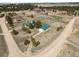 Aerial view of the property showing the house, garage, outbuildings, and expansive acreage at 37653 Lark Dr, Elizabeth, CO 80107