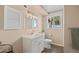 Bright bathroom with a white vanity, updated fixtures and a window with a view at 37653 Lark Dr, Elizabeth, CO 80107