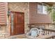 Inviting front door with stone accents and a cozy porch seating area at 37653 Lark Dr, Elizabeth, CO 80107