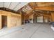 Spacious garage with high ceilings and open storage areas for a workshop at 37653 Lark Dr, Elizabeth, CO 80107