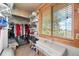 Spacious walk-in closet with built in storage and natural light coming from the window at 37653 Lark Dr, Elizabeth, CO 80107