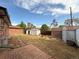 Spacious backyard featuring multiple storage sheds, brick patio, and a partial view of the home's exterior at 10440 Gilpin St, Northglenn, CO 80233