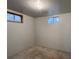 Unfinished basement with visible windows providing natural light, showcasing potential for customization at 10440 Gilpin St, Northglenn, CO 80233