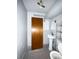Minimalist basement bathroom featuring a pedestal sink and toilet; ready for renovation or a quick update at 10440 Gilpin St, Northglenn, CO 80233