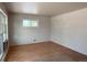 Bright bedroom featuring hardwood floors and a sunny window at 10440 Gilpin St, Northglenn, CO 80233