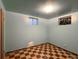 Basement bedroom with checkered floors, natural light, blue walls, awaiting your personal touch at 10440 Gilpin St, Northglenn, CO 80233