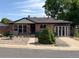 Charming brick home with a well-maintained front yard and mature landscaping at 10440 Gilpin St, Northglenn, CO 80233