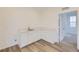 Large, bright laundry room featuring vinyl floors and a granite countertop at 7321 Waterleaf Trl, Littleton, CO 80125