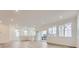 Open-concept living area with lots of light, recessed lights and sliding glass doors at 7321 Waterleaf Trl, Littleton, CO 80125