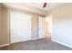 Bedroom featuring carpeted floors, double door closet, and neutral paint at 14300 Waterside Ln # L5, Broomfield, CO 80023