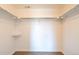 Walk-in closet with shelves and a rod for hanging clothes at 14300 Waterside Ln # L5, Broomfield, CO 80023