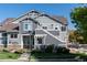 Charming two-story townhome with manicured lawn and pleasant neighborhood setting on a clear day at 14300 Waterside Ln # L5, Broomfield, CO 80023