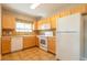 Functional kitchen boasts tile flooring, ample cabinet space, and essential appliances at 14300 Waterside Ln # L5, Broomfield, CO 80023