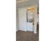 Efficient laundry closet with stacked washer and dryer unit for added convenience at 14300 Waterside Ln # L5, Broomfield, CO 80023