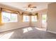 Bright living room with large windows and neutral tones, enhanced by stylish window coverings at 14300 Waterside Ln # L5, Broomfield, CO 80023