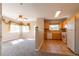 Inviting living room seamlessly connecting to the kitchen, featuring modern finishes and ample natural light at 14300 Waterside Ln # L5, Broomfield, CO 80023