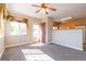 Bright living room featuring neutral paint, carpeted floors, and natural light from a large window at 14300 Waterside Ln # L5, Broomfield, CO 80023