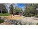 Gathering-friendly playground featuring swings and slides in a well-maintained, grassy community park at 14300 Waterside Ln # L5, Broomfield, CO 80023
