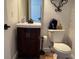 Bathroom with vanity sink and toilet at 9649 Lansing Cir, Commerce City, CO 80022