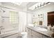 The bathroom has a skylight, a shower-bathtub, and a granite countertop at 843 Adams St, Denver, CO 80206